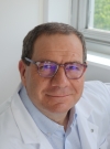 Dr. Alain Carri�